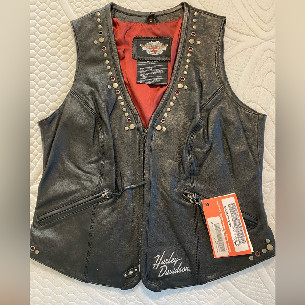 Harley Davidson black leather vest with stud accents. Brand new with tags